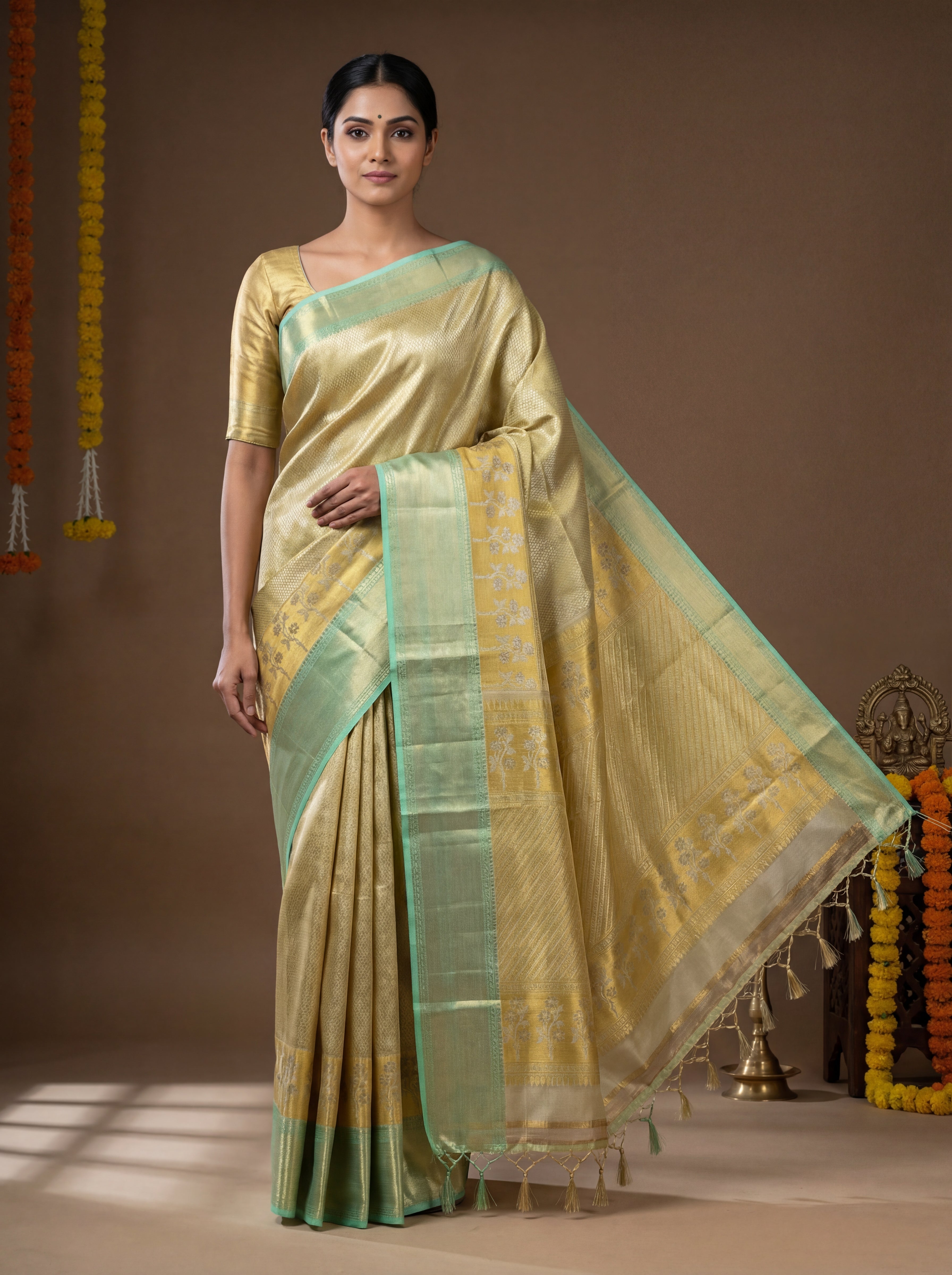 Soft Gold Tissue Silk Saree with Floral Zari Border & Mint Green Selvedge – Elegant Traditional Weave