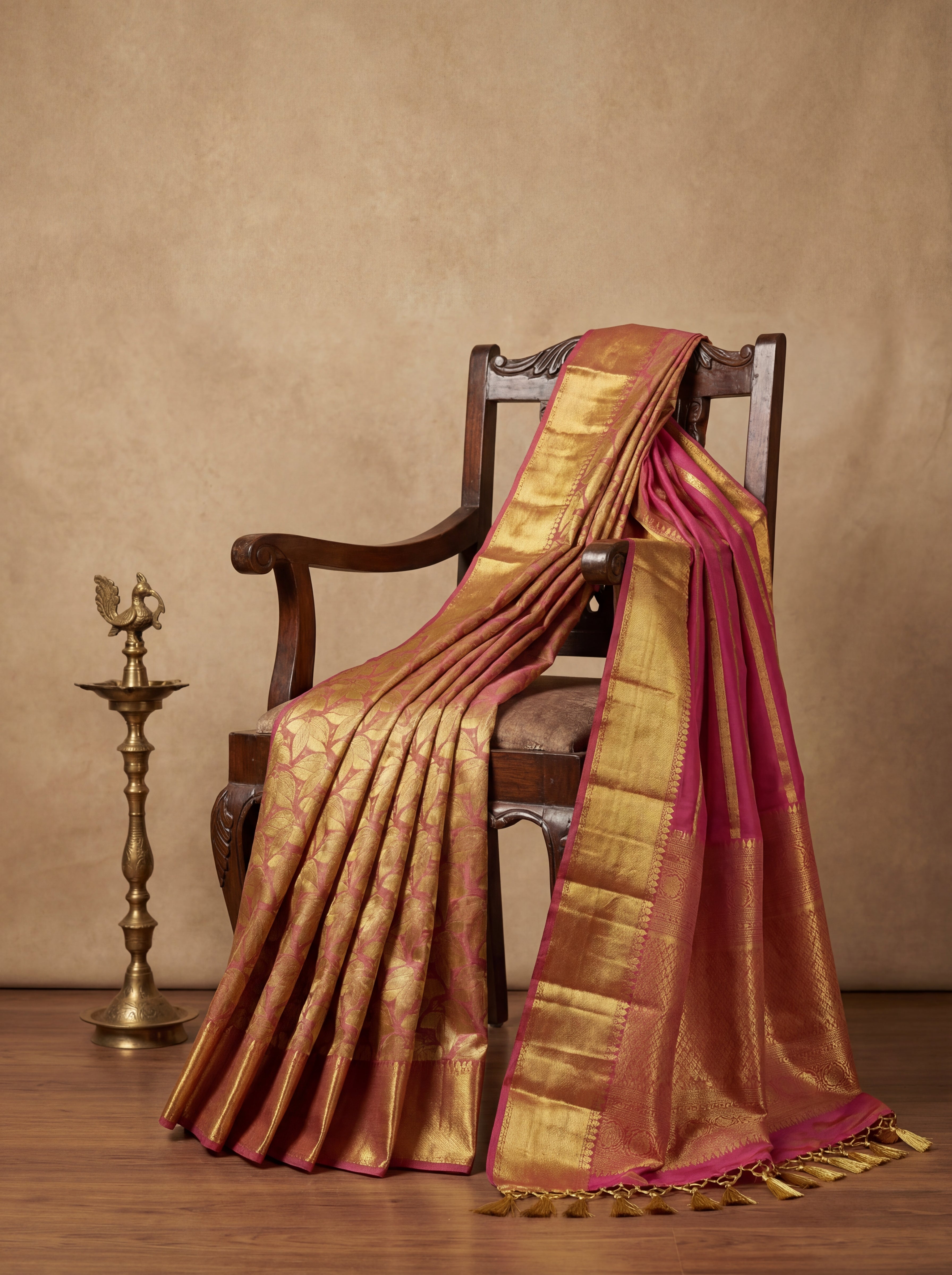 Gold Tissue Silk Saree with All-Over Leaf Motifs & Contrast Pink Border – Rich Traditional Festive Weave